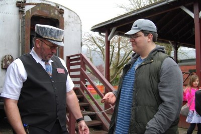 First passenger boarding NW Railway Museum train for the 2013 season. Photo: Museum Facebook page